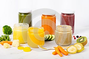 Variety of homemade baby vegetable and fruit puree