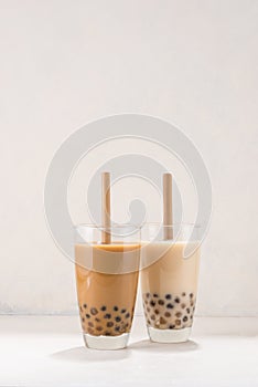 Variety of homemade bubble tea/ boba tea with tapioca pearls on white background