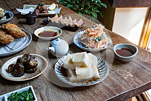 A variety of Japanese dishes such tonkatsu, gyoza, agedashi tofu, tempura, fried eggplant, etc