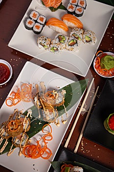 Variety of Japanese food dishes on the wooden table. Vertical picture