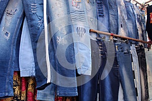 Variety of jeans pant cloths selling on a open shop at a busy market, at Esplanade, Kolkata.