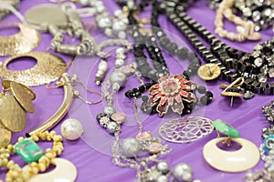 variety of jewellery on purple table