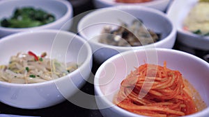 Variety of Korean small side dishes full table bbq meal