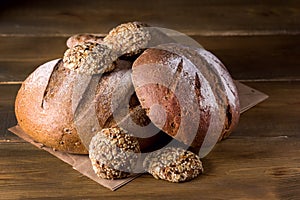 Variety of Loafs Fresh Baked Rye and Whole Grain Bread on Wooden Texture Background Dark Photo Variety of Bread Copy Space