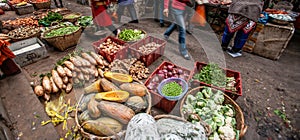 A variety of local vegetables and fruits in a daily market at Nansa, Yunnan, China. Winter fruits and vegetables
