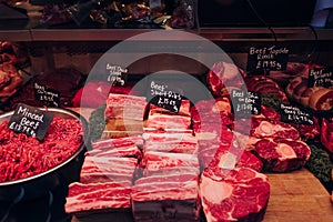 Variety of meat products at a food market stall in London, UK
