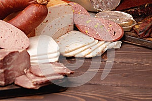 Variety of meat and sausage products on table