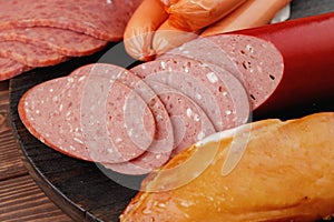 Variety of meat and sausage products on table