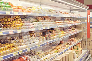 A variety of meats at a grocery store.