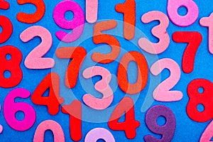 Variety of Numbers in red and pink on blue