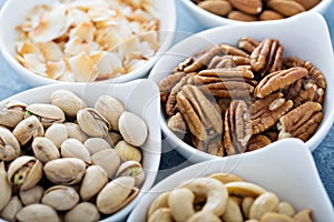 Variety of nuts in small bowls