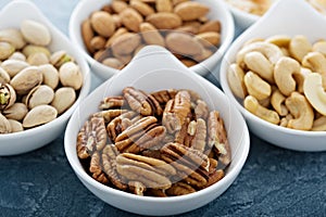 Variety of nuts in small bowls