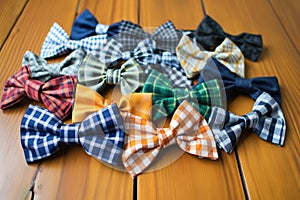 variety of patterned bow ties spread flat on a table
