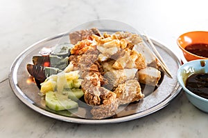 Variety of Penang Lobak, popular fried meat with chilli dips photo