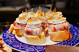 Variety of pinchos pintxos in bar of San Sebastian Donostia, Spain