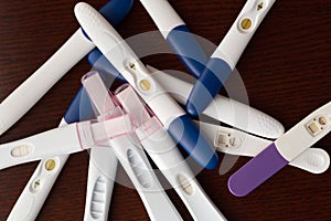 Variety of Pregnancy Tests Piled Up Together
