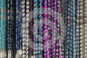 Variety of rosaries in a store selling religious products