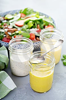 Variety of salad dressings in glass jars
