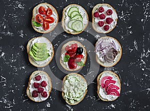 Variety of sandwiches - sandwiches with cheese, tomatoes, anchovies, roasted peppers, raspberries, avocado, bean pate, cucumber