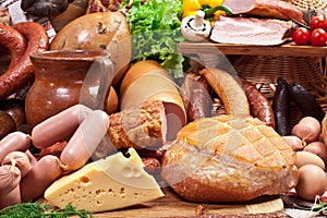 Variety of sausage products, cheese, eggs and vegetables.
