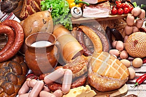 Variety of sausage products, cheese, eggs and vegetables.