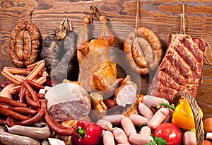 Variety of sausage products and vegetables.