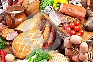 Variety of sausage products with vegetables.