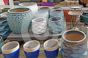sizes and colors of large clay and porcelain flower pots for Spring planting photo