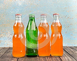 Variety of soda bottle on the wooden background