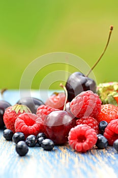 Variety of soft fruits, strawberries, raspberries, cherries, blueberries on table