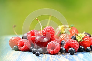 Variety of soft fruits, strawberries, raspberries, cherries, blueberries on table