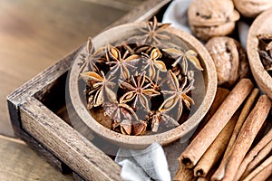 Variety of Spices Anise Stars Cinnamone Sticks Nuts Christmas Ingredients for Cake Above photo