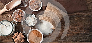 A variety of sucrose varieties on a natural wooden background.