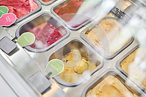 A variety of sugar-free vegan ice cream with natural ingredients on display at the gelateria. Flavors various ice cream