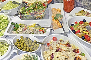 Variety of tasty and fresh food on table close up