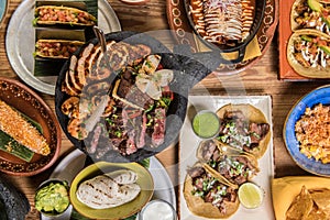 Variety of tasty Mexican food on a restaurant table