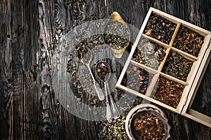 Variety of teas, mixes in copper dish, topview photo