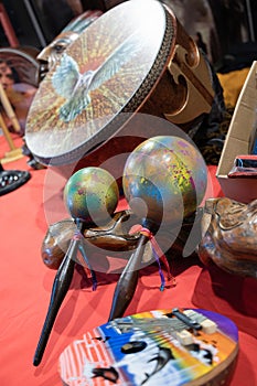 Variety of traditional percussion instruments maracas, large drum.