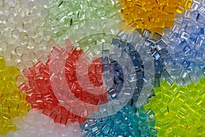 variety of transparent dyed plastic granulates