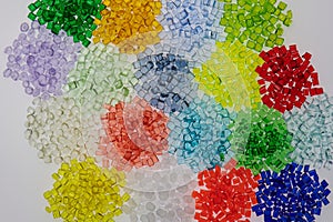 variety of transparent dyed plastic granulates photo