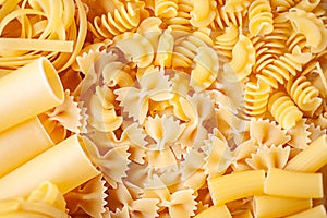 Variety of types and shapes of dry Italian pasta