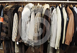 Variety of used coats at the market for sale