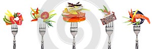 Variety of vegetables and cheeses on forks - white background