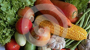 Variety of vegetables, mushrooms, tomatoes, peppers, garlic, green leafy vegetables for cooking delicious family meals.