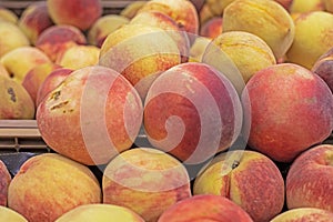 variety of white peaches in a plastic container