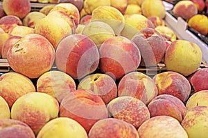variety of white peaches in a plastic container