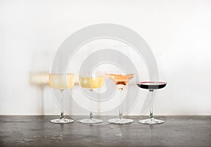 Variety of wine types over concrete table, copy space