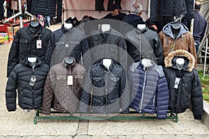 A variety of winter jacket for sale in preparation for harsh winter