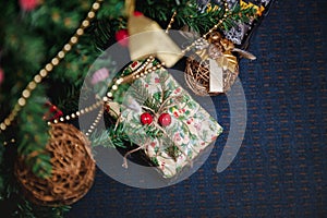 A variety of wrapped gifts under a festively decorated Christmas tree. Life style
