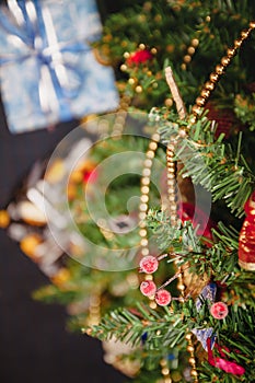 A variety of wrapped gifts under a festively decorated Christmas tree. Life style